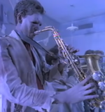 A zombie rocks out in the music video for "Be Chrool To Your Scuel."